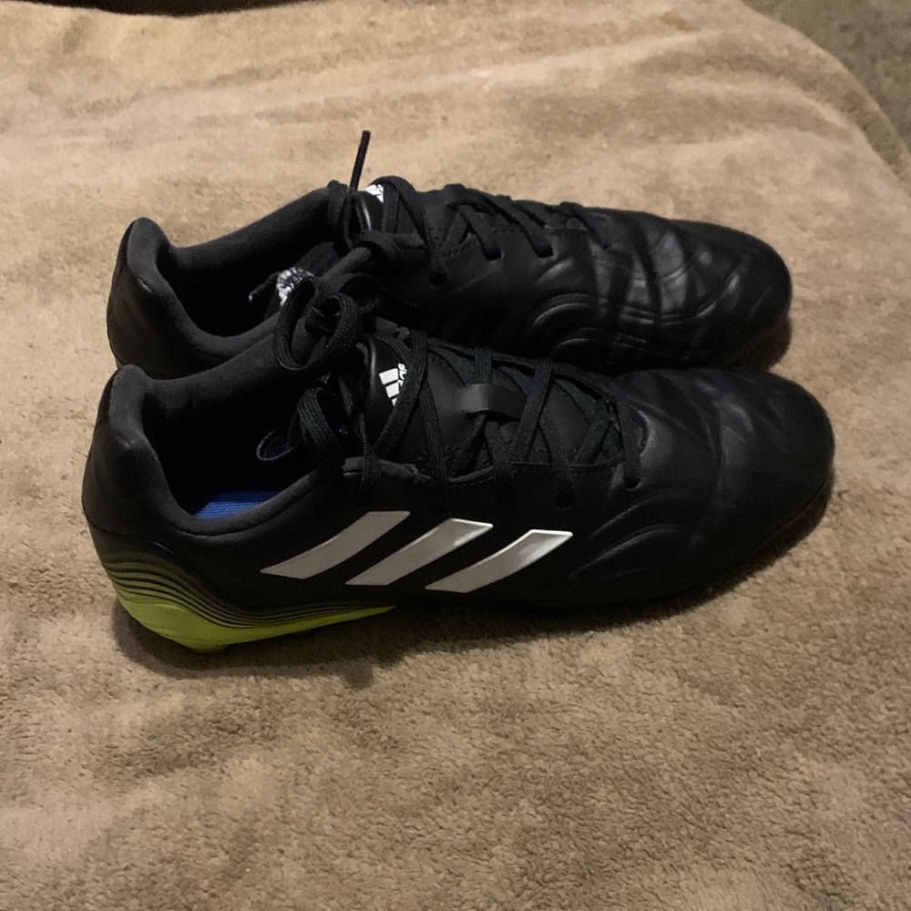 Adidas Black Cleats with White and Green Accents